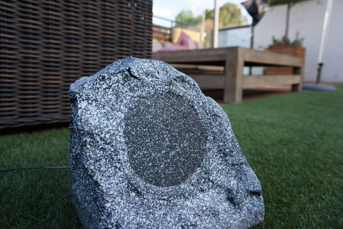 a shape-rock speaker on the ground
